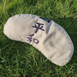 Coussin demi lune beige naturel Paix